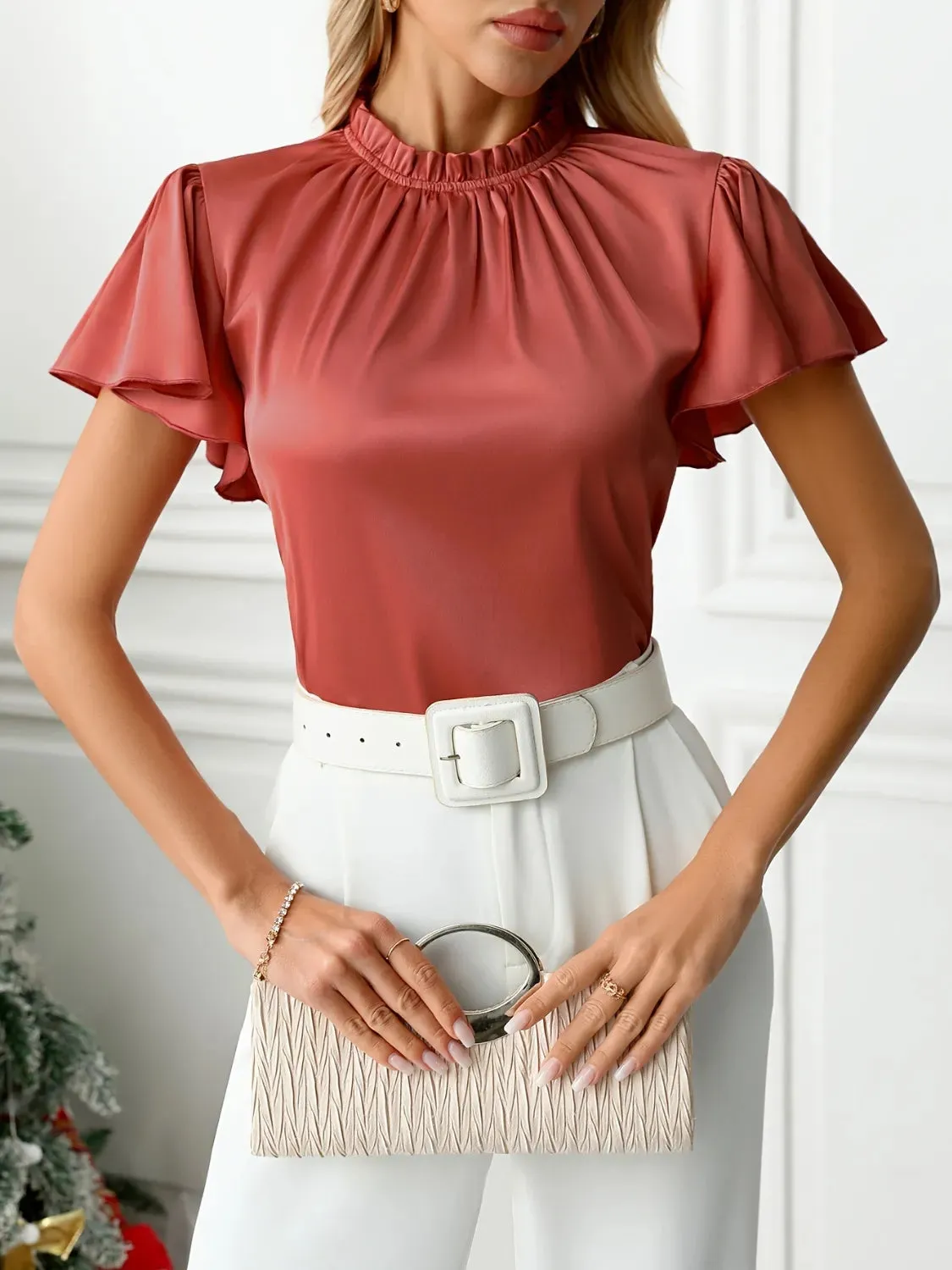 Mock Neck Flutter Sleeve Blouse sold by Charming Charlie