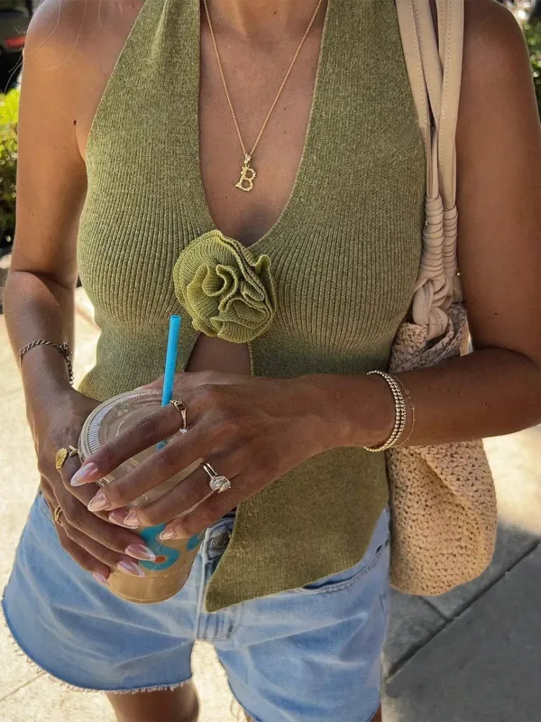 V-Neck Ribbed Knit Sweater Vest with Flower Detail sold by Charming Charlie
