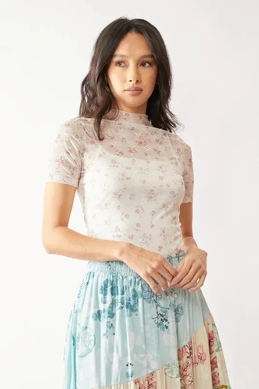 Davi & Dani Floral Mesh Mock Neck Short Sleeve Top sold by Charming Charlie