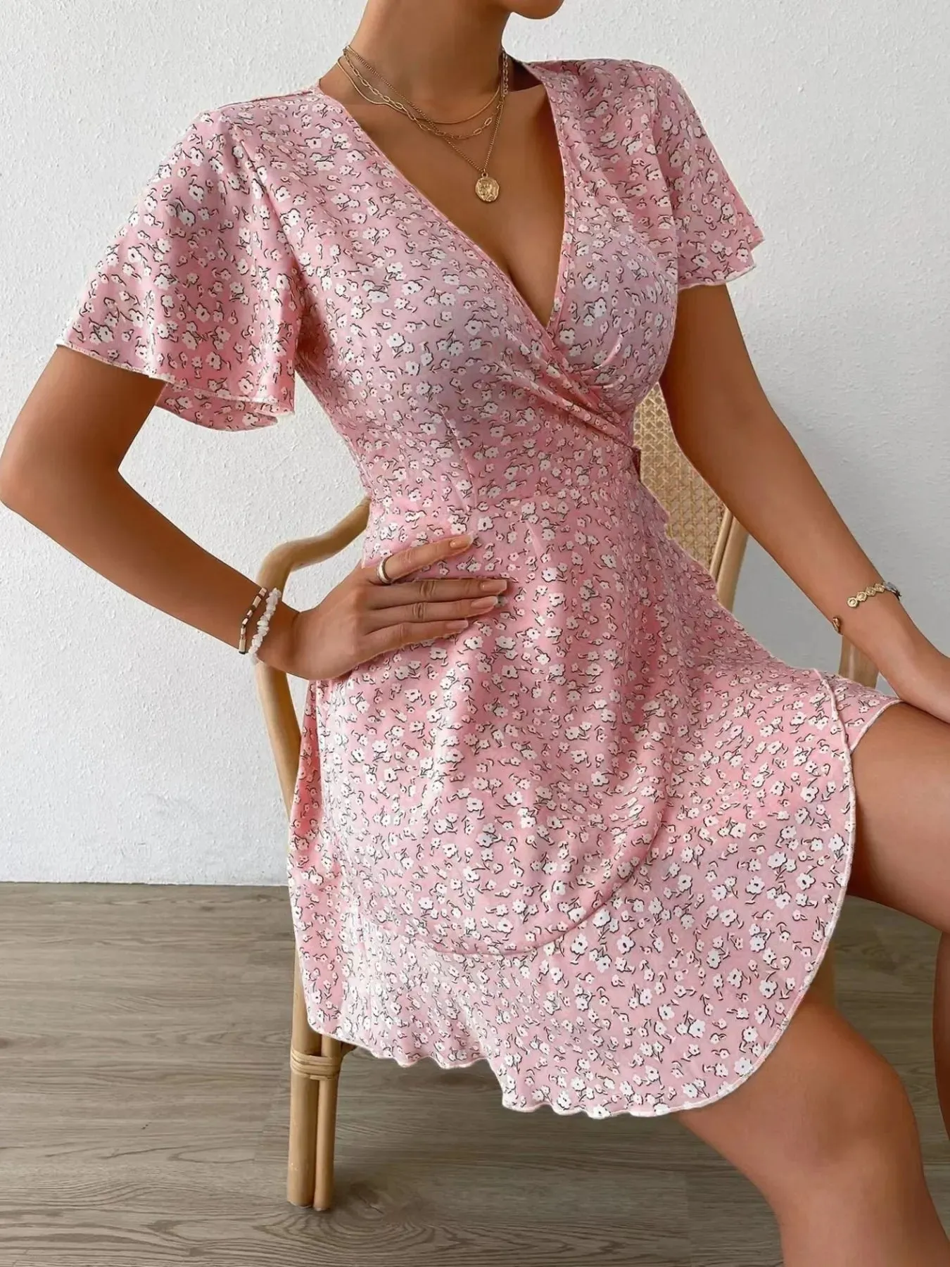 Floral Flutter Sleeve Wrap Mini Dress sold by Charming Charlie product image thumbnail 4