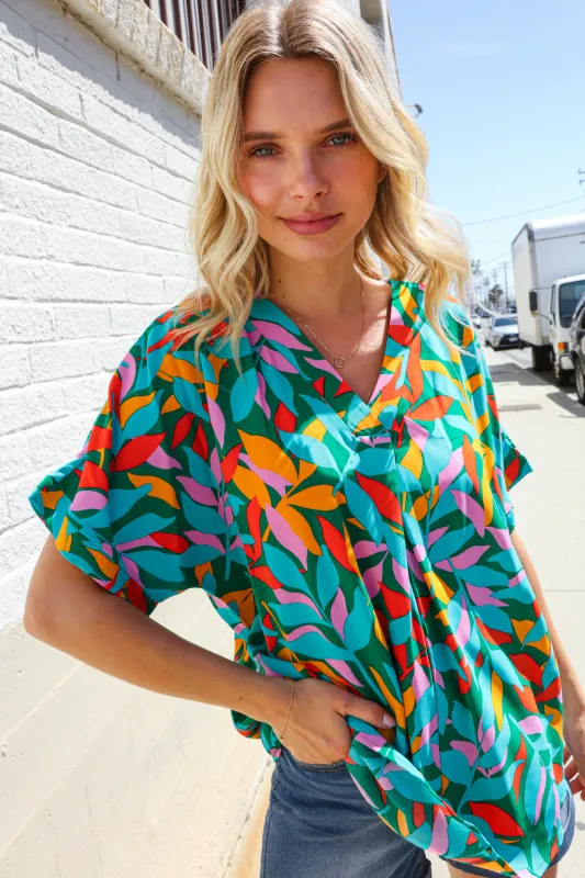 Vacay Ready Green Tropical Floral Banded V Neck Dolman Top sold by Charming Charlie