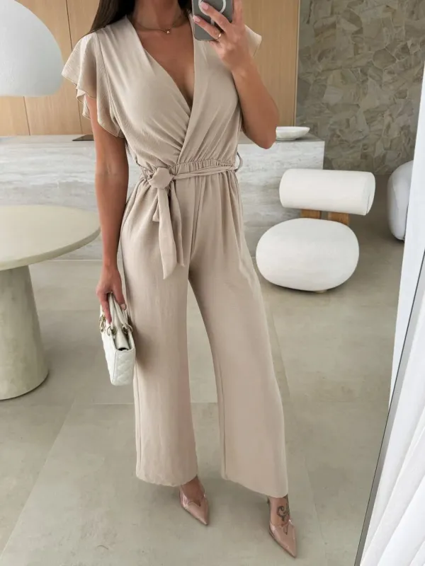 Surplice Wide Leg Belted Jumpsuit sold by Charming Charlie
