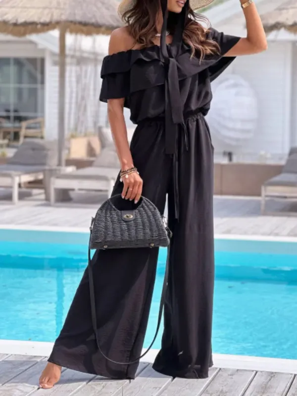 Off-Shoulder Ruffled Wide Leg Jumpsuit sold by Charming Charlie