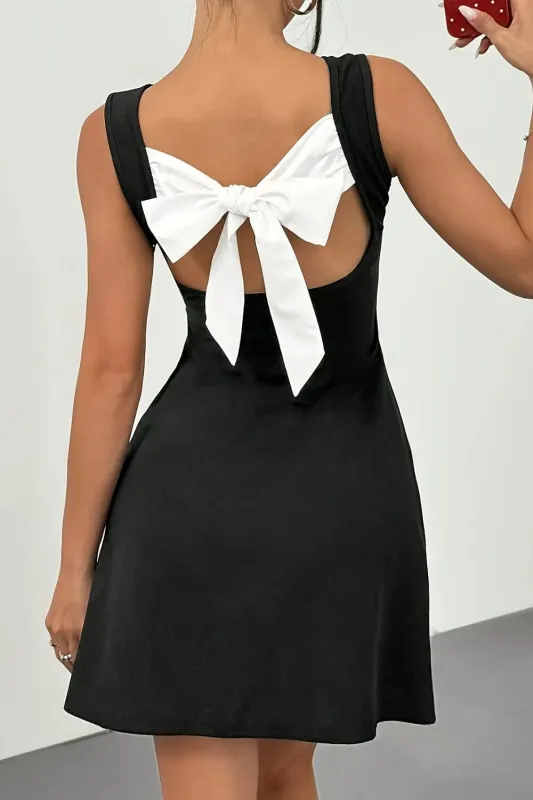 Backless Bow Detail Mini Dress sold by Charming Charlie