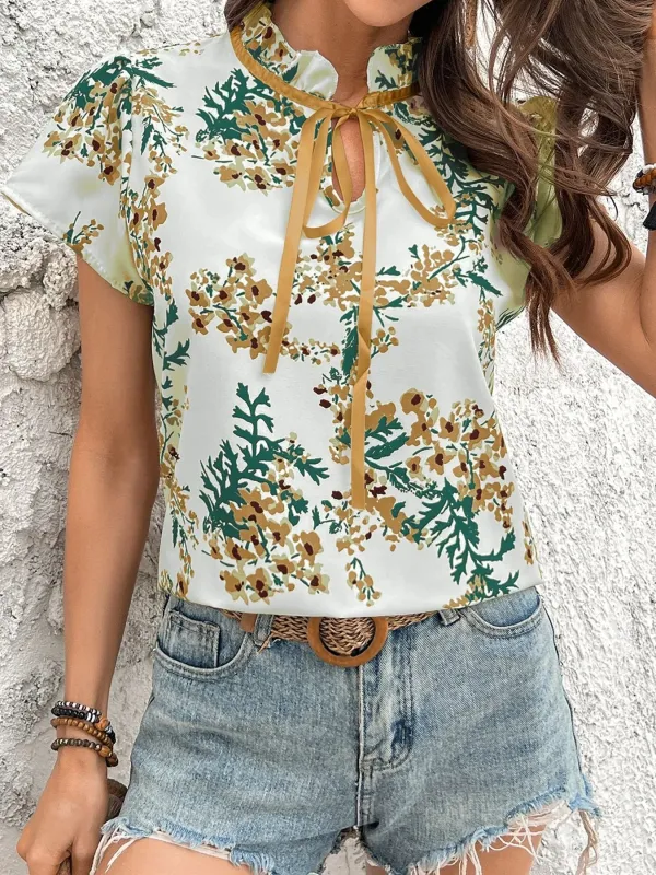 Floral Print Tie Neck Short Sleeve Blouse sold by Charming Charlie