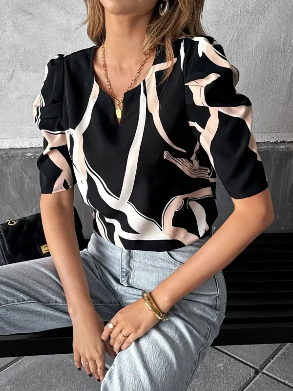 Abstract Print Puff Sleeve Notched Blouse sold by Charming Charlie