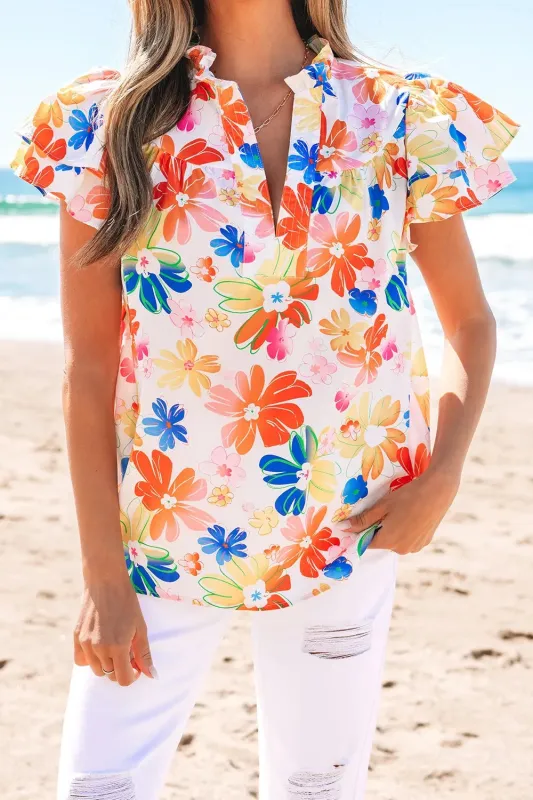 Ruffled Printed Notched Cap Sleeve Blouse sold by Charming Charlie