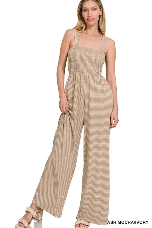 SMOCKED TOP STRIPED JUMPSUIT sold by Charming Charlie