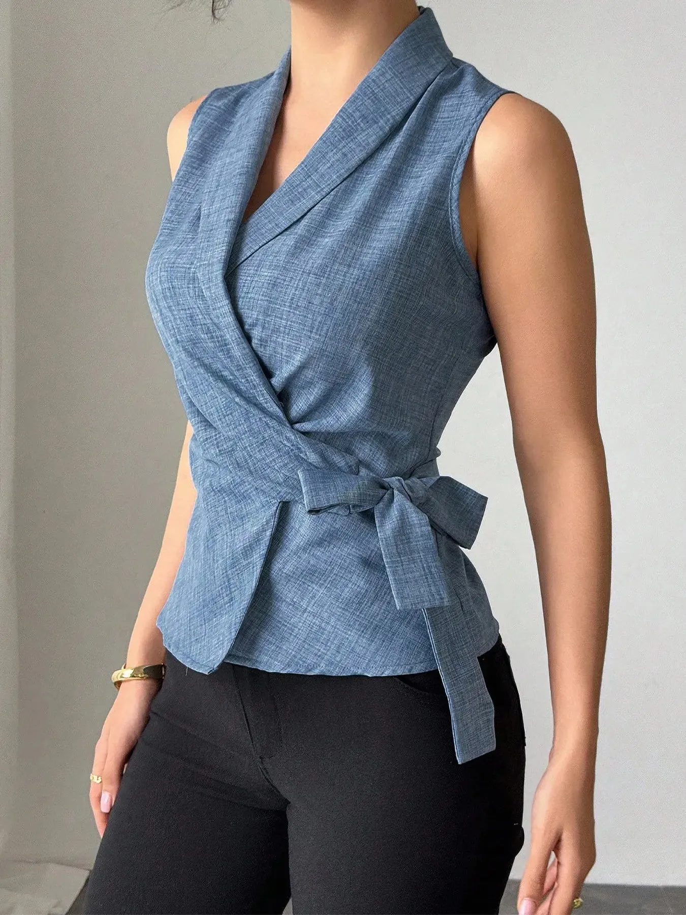 Sleeveless Tied Surplice Top sold by Charming Charlie