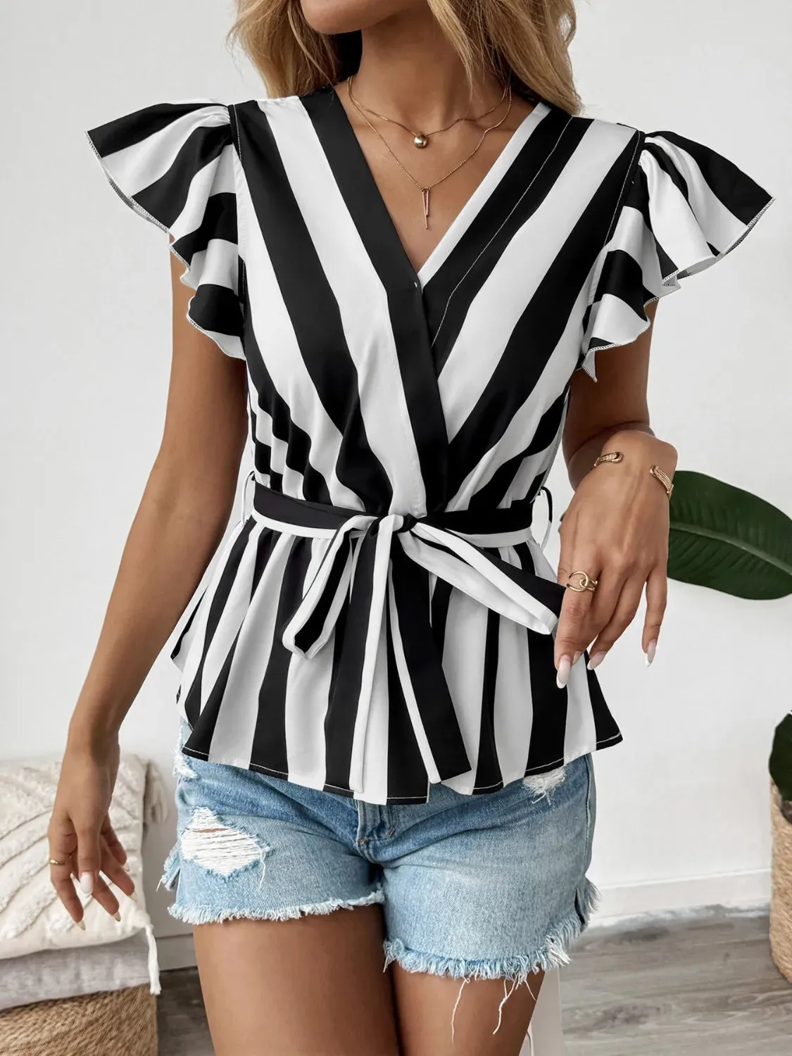 Striped Surplice Flutter Sleeve Wrap Blouse sold by Charming Charlie product image thumbnail 4