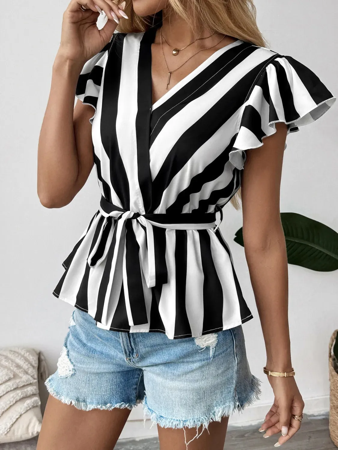 Striped Surplice Flutter Sleeve Wrap Blouse sold by Charming Charlie product image thumbnail 2