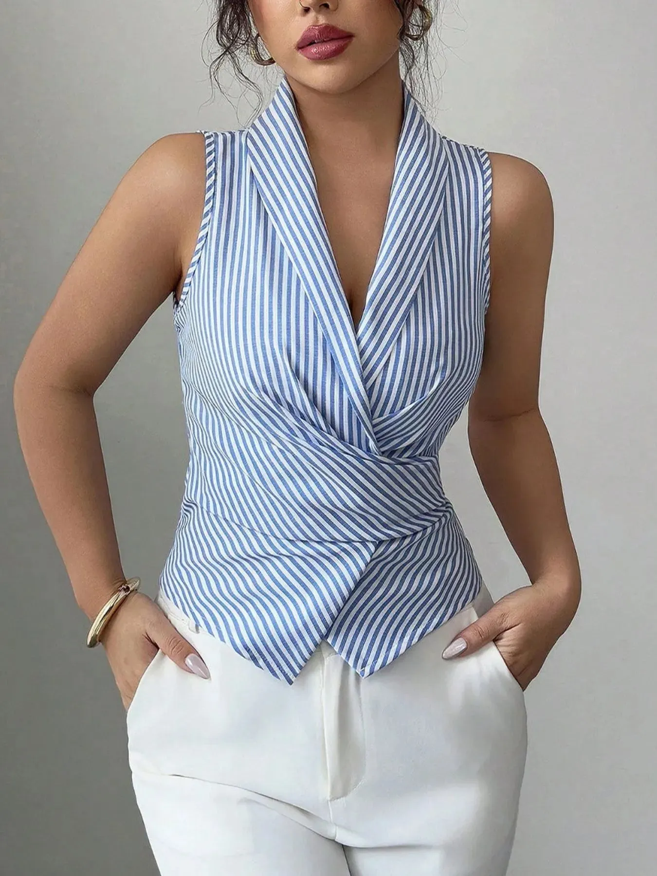 Striped Sleeveless Wrap Blouse sold by Charming Charlie