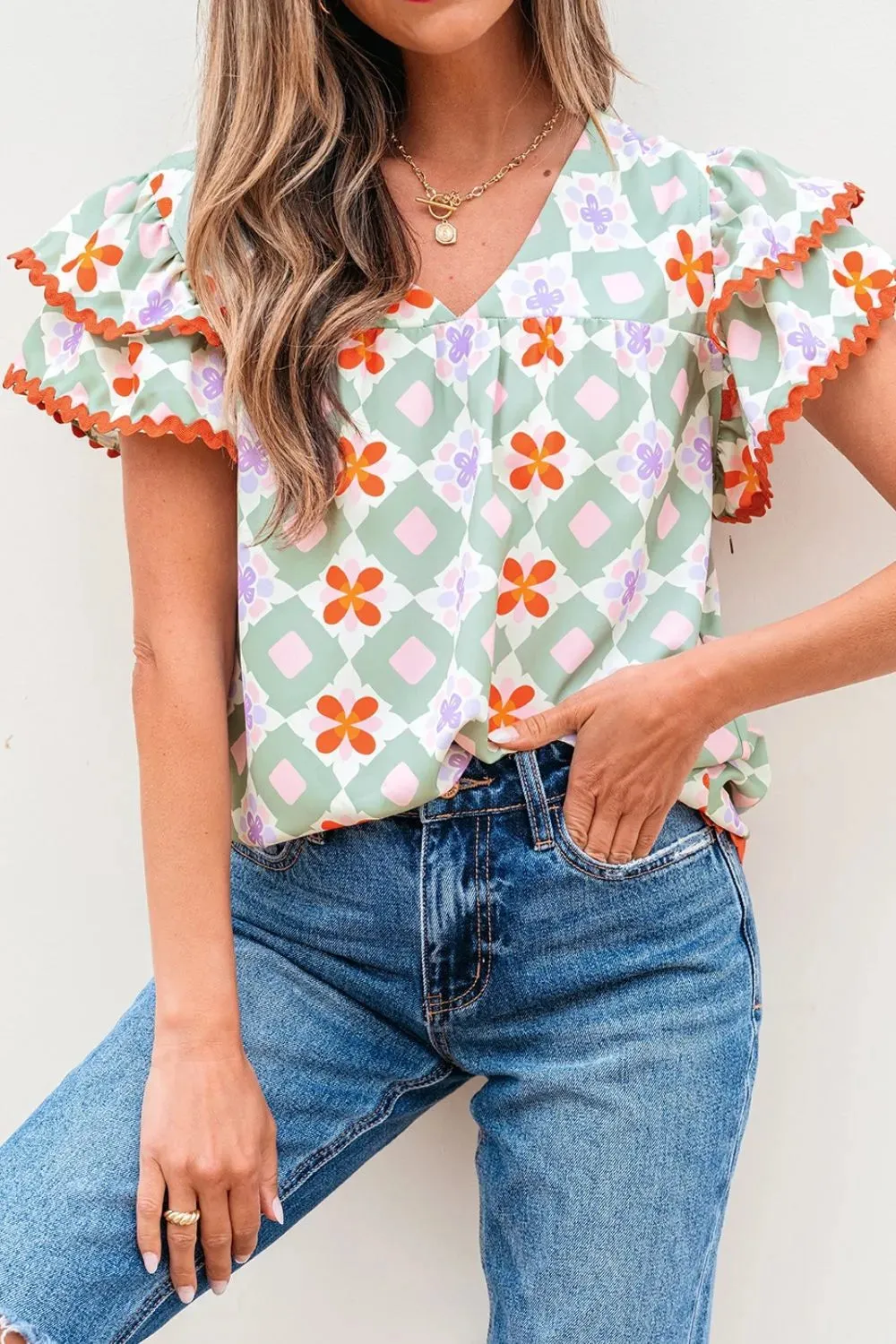 Floral Print V-neck Flutter Sleeve Blouse sold by Charming Charlie