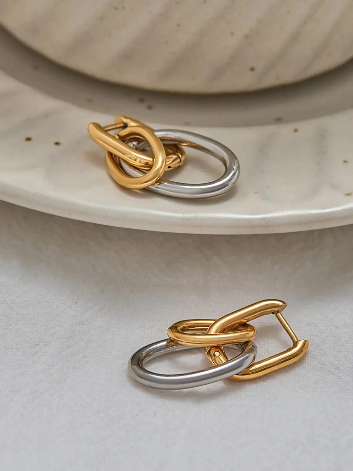 Stainless Steel Two-Tone Interlocked Hoop Earrings sold by Charming Charlie product image thumbnail 4