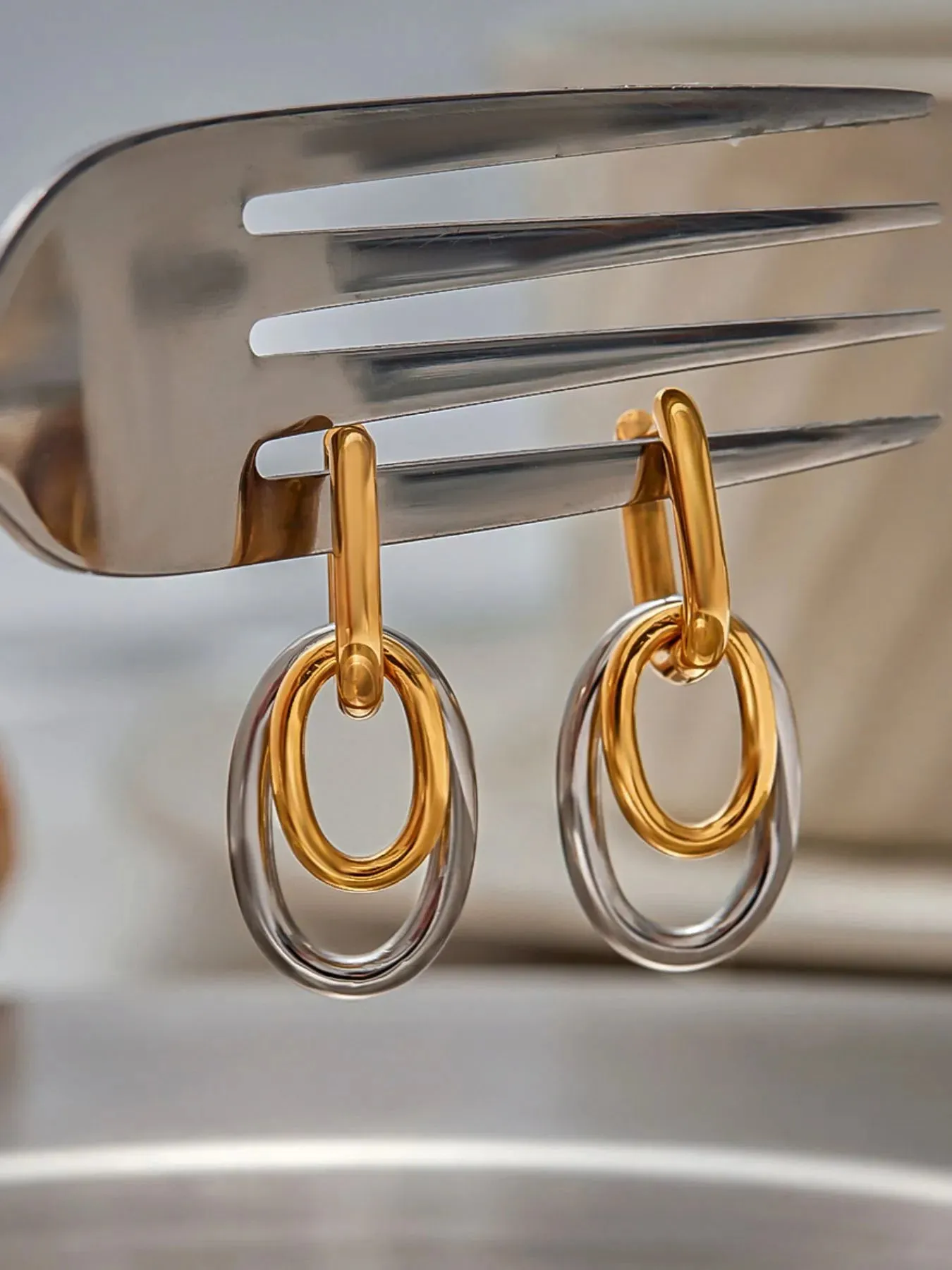 Stainless Steel Two-Tone Interlocked Hoop Earrings sold by Charming Charlie product image thumbnail 5