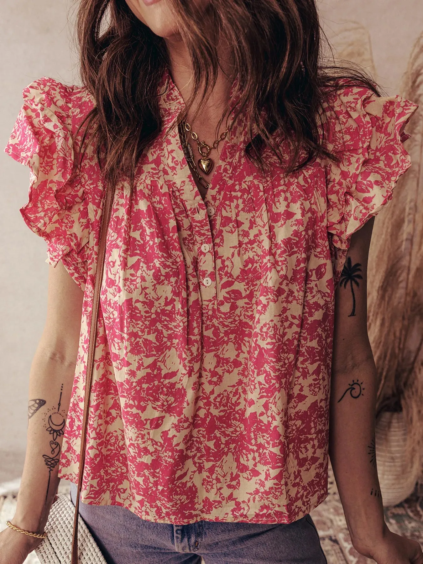 Printed Half Button Neck Ruffle Sleeve Blouse sold by Charming Charlie