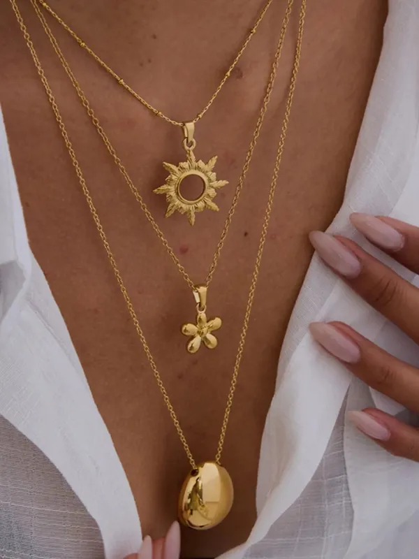 3-Piece 18K Gold-Plated Sun Flower Pendant Necklace sold by Charming Charlie