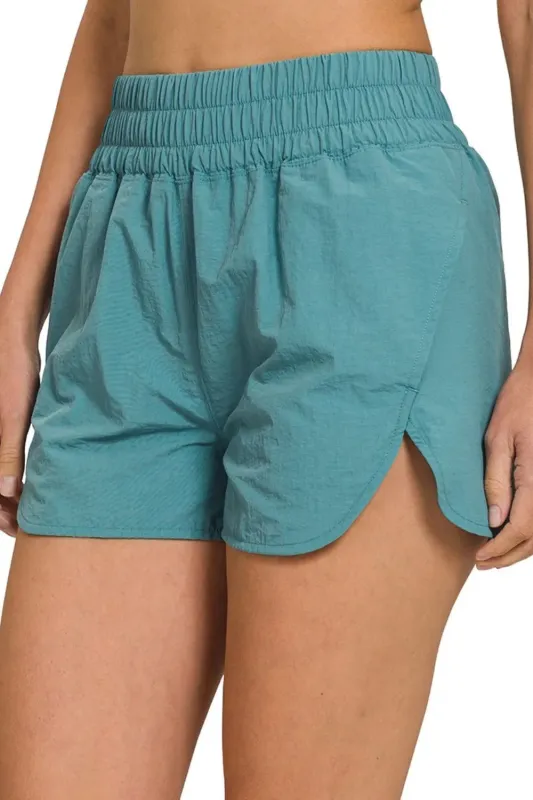 Zenana Windbreaker Smocked Waistband Running Shorts sold by Charming Charlie