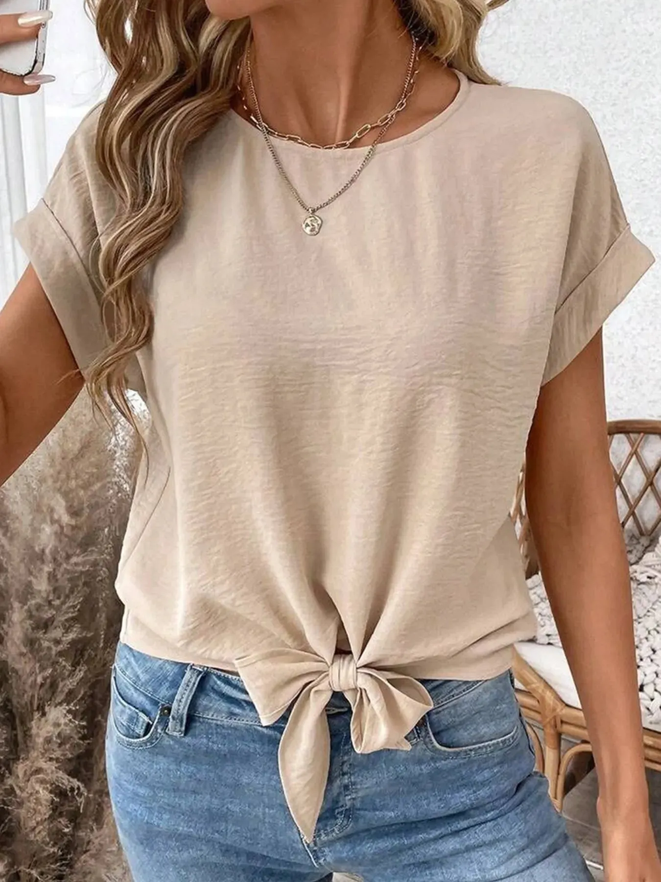 Solid Color Knotted Hem Short Sleeve Blouse sold by Charming Charlie
