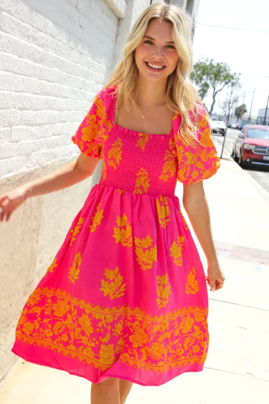 Beautiful You Coral Floral & Border Print Smocked Dress sold by Charming Charlie