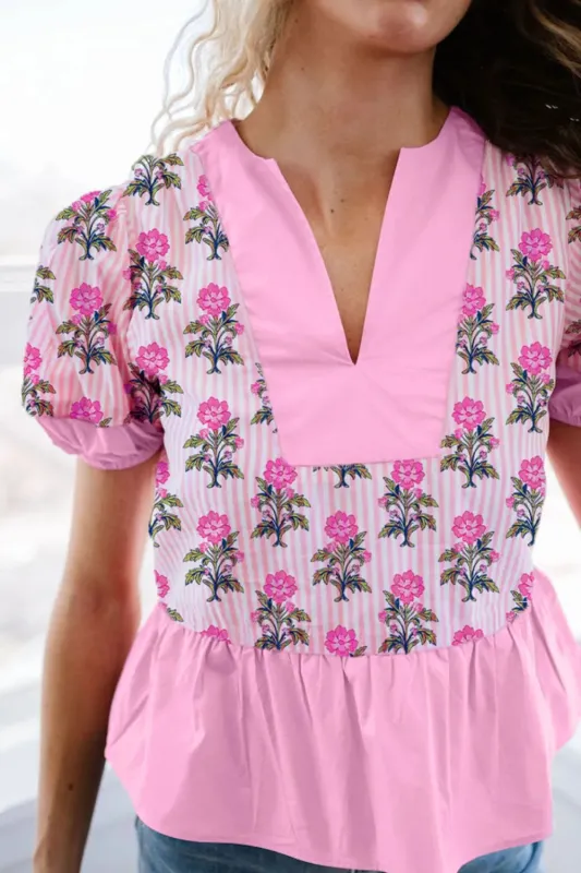 Floral Notched Peplum Blouse sold by Charming Charlie