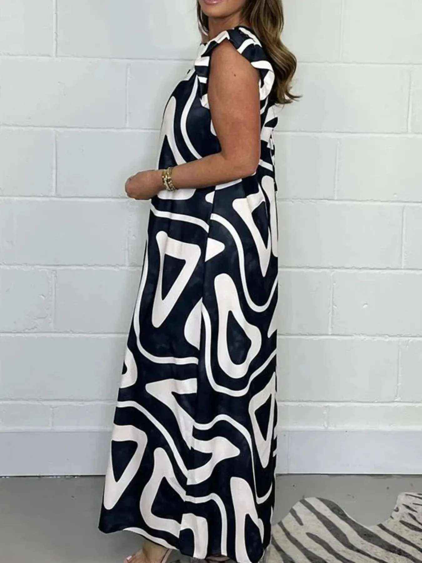Full Size Printed Wide-Leg Jumpsuit with Flutter Sleeves Plus Size sold by Charming Charlie product image thumbnail 2