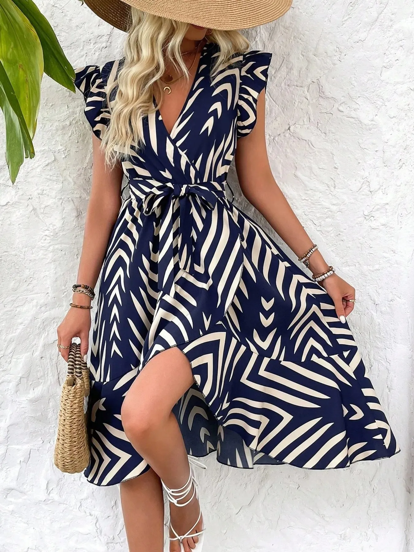 Geometric Print Surplice Flutter Sleeve Dress sold by Charming Charlie