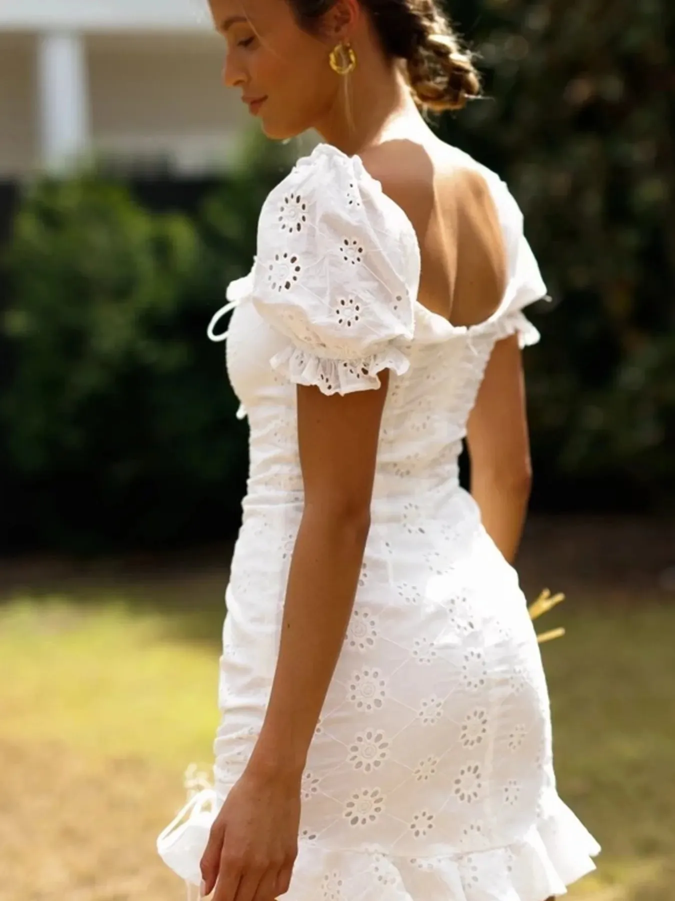 Eyelet Ruffled Hem Lace Up Mini Dress sold by Charming Charlie product image thumbnail 3