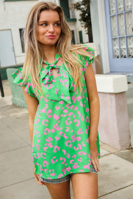 Be Bold Green Animal Print Bow Tie Flutter Sleeve Top sold by Charming Charlie