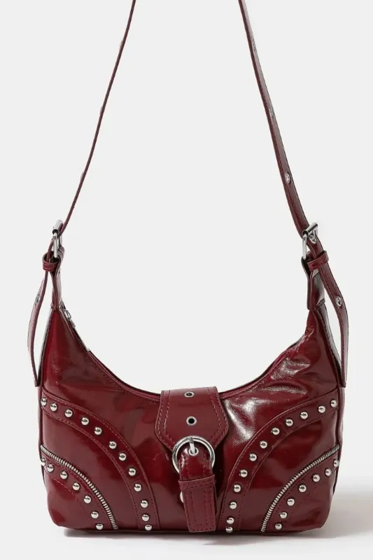 Fame Faux Leather Studded Trim Shoulder Bag sold by Charming Charlie