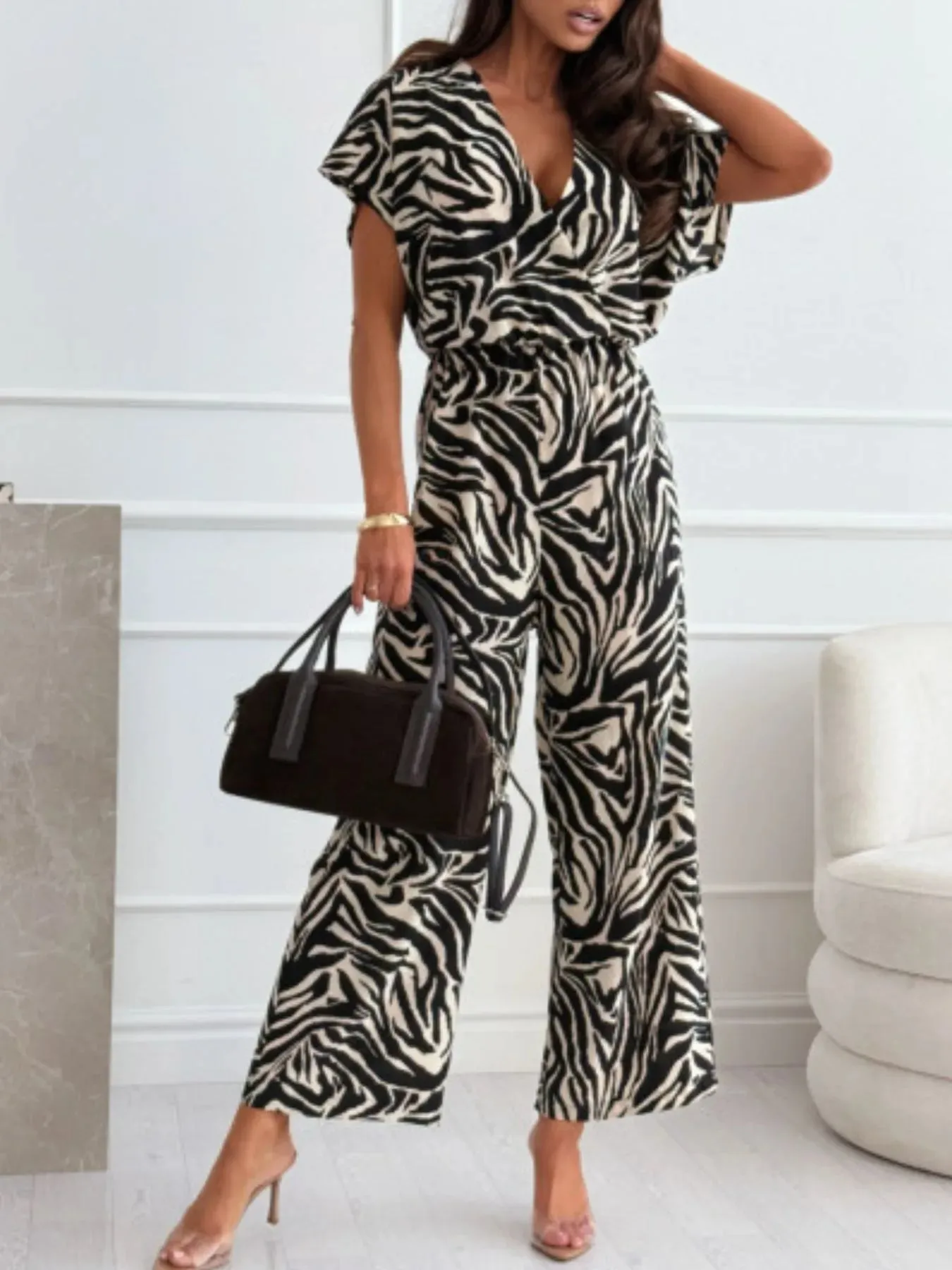 Animal Print Wide Leg Jumpsuit sold by Charming Charlie