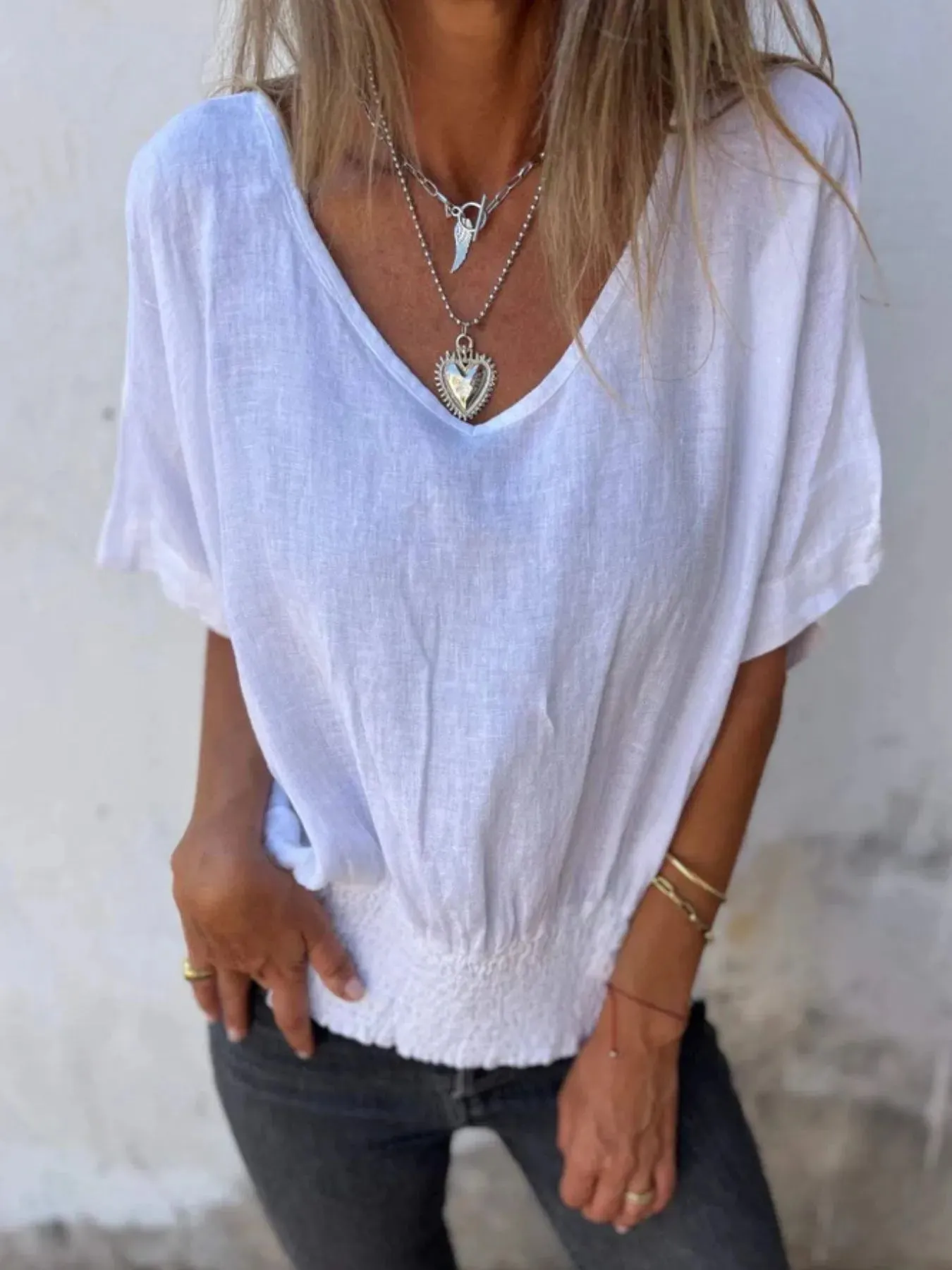 Full Size Smocked Hem V-Neck Relaxed Fit T-Shirt Plus Size sold by Charming Charlie