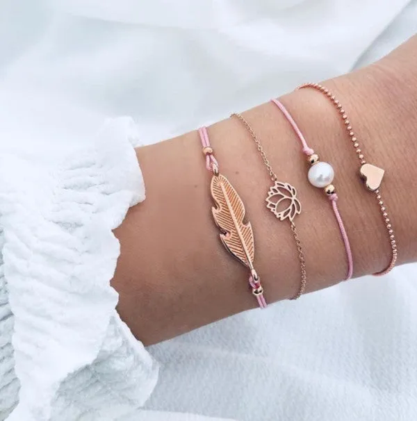 Pink Gold Feather Lotus Summer Bracelet Set sold by Charming Charlie