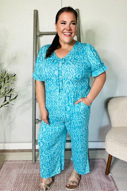 PLUS Spring Vibes Aqua Ikat Print Ruffle Sleeve Wide Leg Jumpsuit sold by Charming Charlie