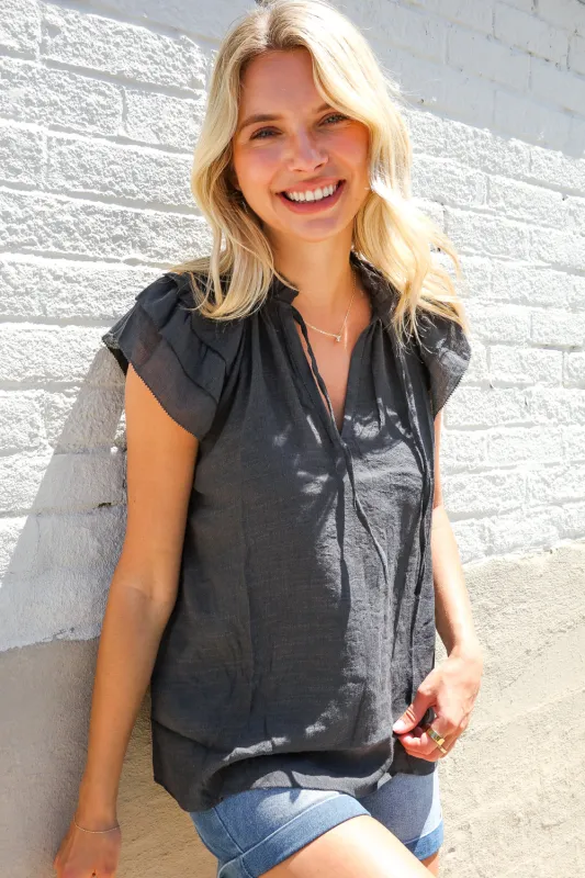 Weekend Ready Charcoal Frill Front Tie Double Ruffle Sleeve Top sold by Charming Charlie