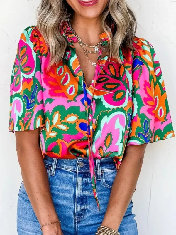 Tropical Print Short Sleeve Tie Neck Blouse sold by Charming Charlie