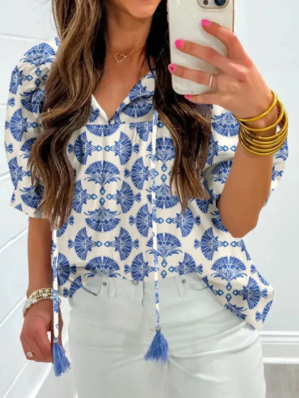 Printed Tassel Tie Neck Blouse sold by Charming Charlie