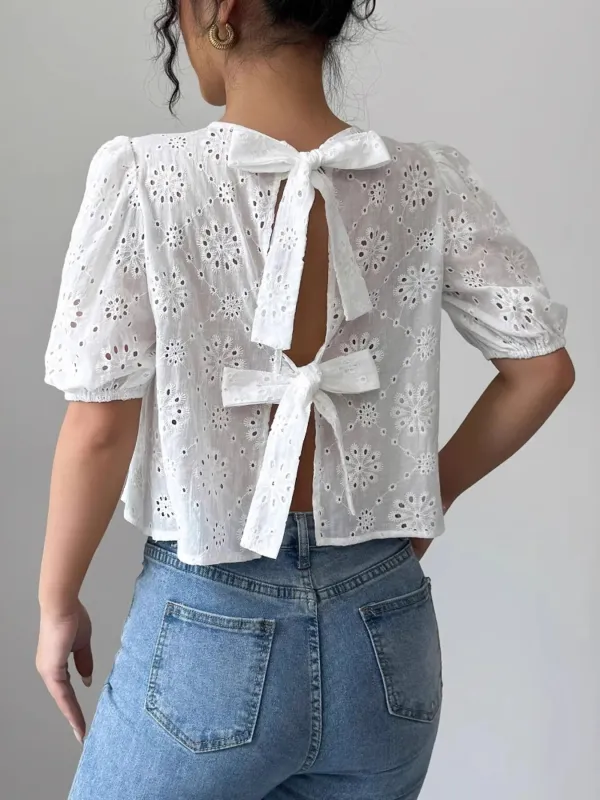 Eyelet Embroidered Puff Sleeve Tie-Back Blouse sold by Charming Charlie