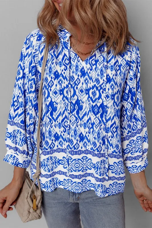 Blue Boho Printed 3/4 Sleeve Tied Neck Blouse sold by Charming Charlie