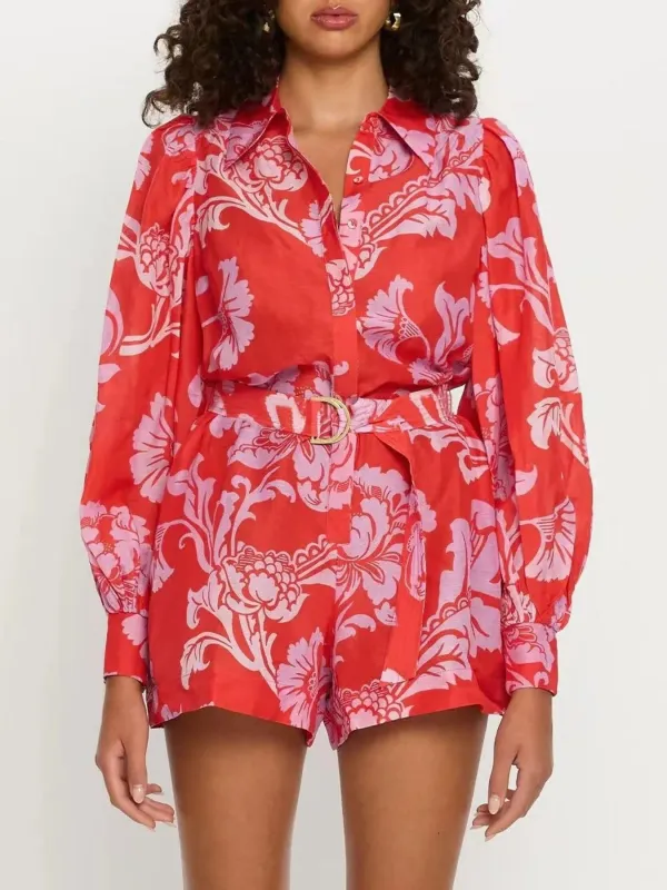Printed Long Sleeve Belted Romper sold by Charming Charlie