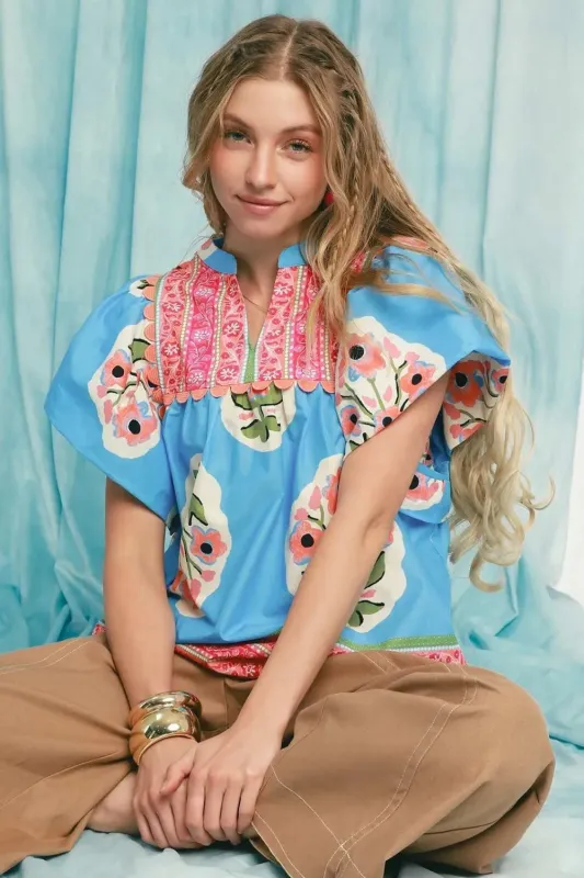 Umgee Floral Notched Puff Sleeve Blouse sold by Charming Charlie