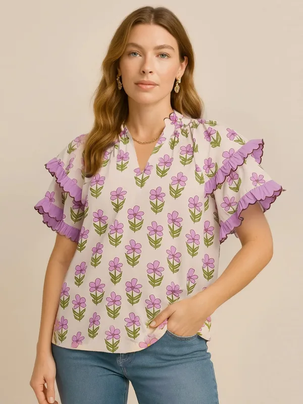 Umgee Floral Print Ruffle Short Sleeve Blouse sold by Charming Charlie