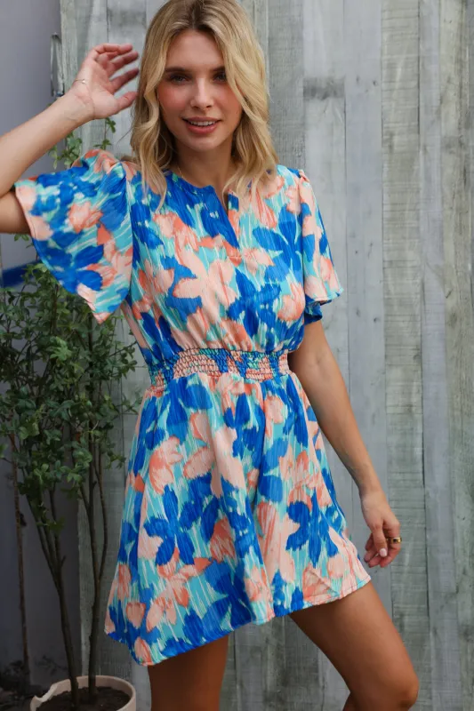 Feeling Bold Turquoise Floral Smocked Waist Flutter Sleeve Romper sold by Charming Charlie