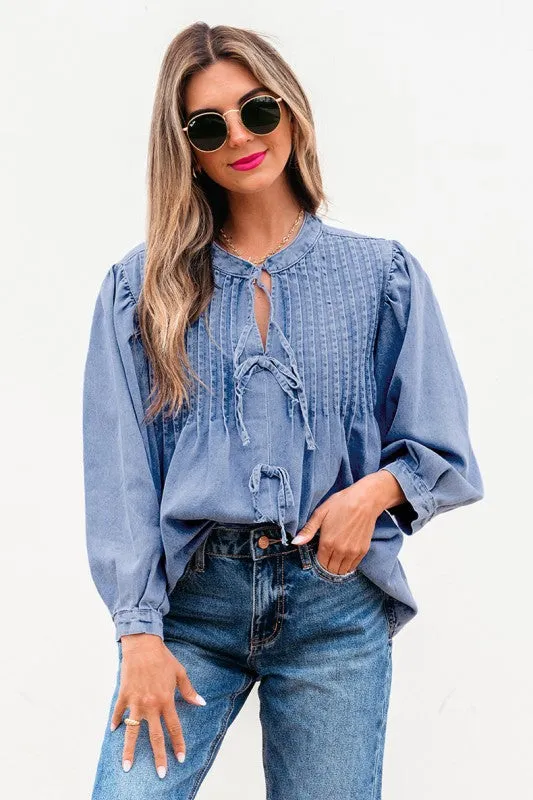 Denim Front Pintuck Bow Tie Puff Sleeve Top sold by Charming Charlie