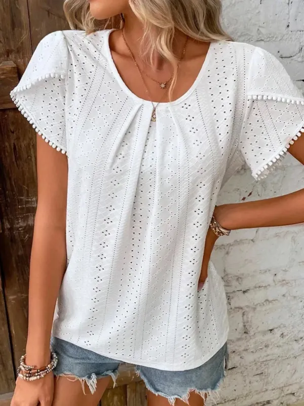 Eyelet Petal Sleeve Top with Pom Pom Trim sold by Charming Charlie