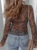 Leopard Sheer Mesh Long Sleeve V Neck Lace-Up Blouse sold by Charming Charlie