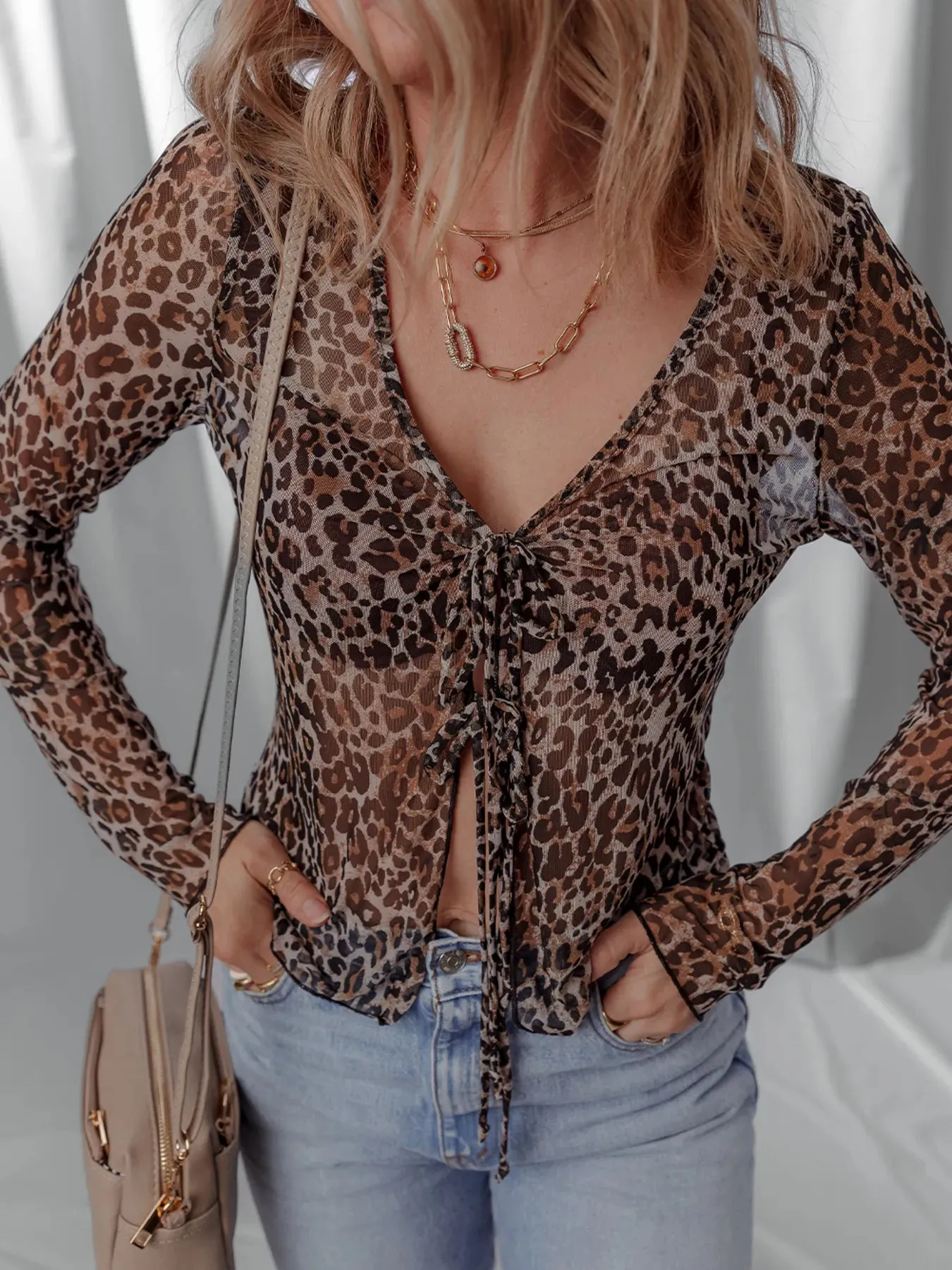 Leopard Sheer Mesh Long Sleeve V Neck Lace-Up Blouse sold by Charming Charlie product image thumbnail 4