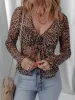 Leopard Sheer Mesh Long Sleeve V Neck Lace-Up Blouse sold by Charming Charlie