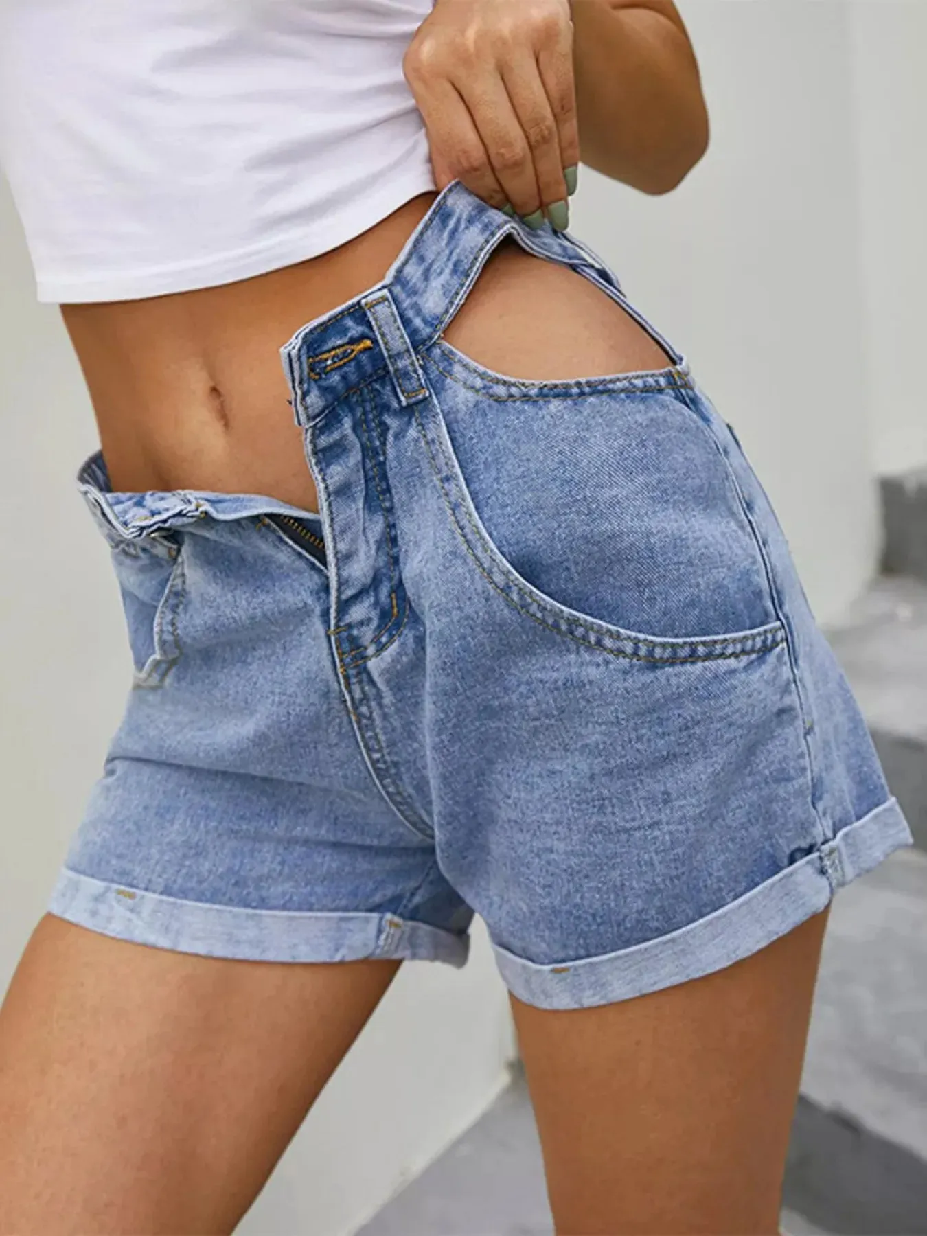 High-Waisted Cutout Denim Shorts sold by Charming Charlie