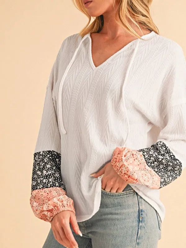 Floral Patchwork Cable Texture Drawstring V Top sold by Charming Charlie